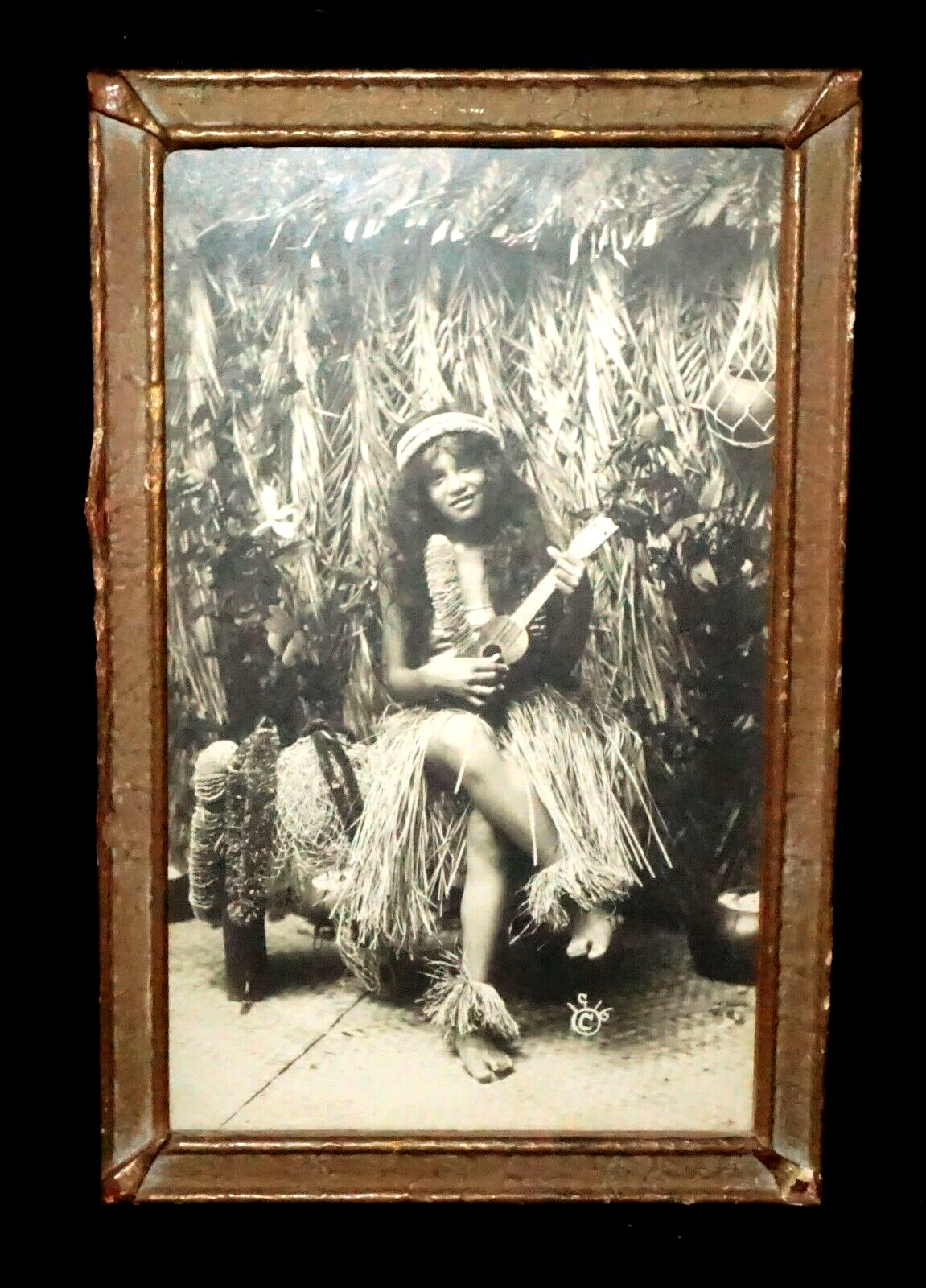 1916 Photograph of Hawaiian Hula Girl Playing Ukulele Next to Grass Shack (KoR)