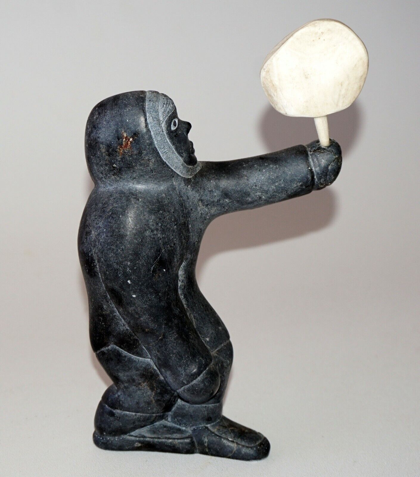 1979 Eskimo Stone Carved Sculpture Figure Holding Carved Object signed (Kor)