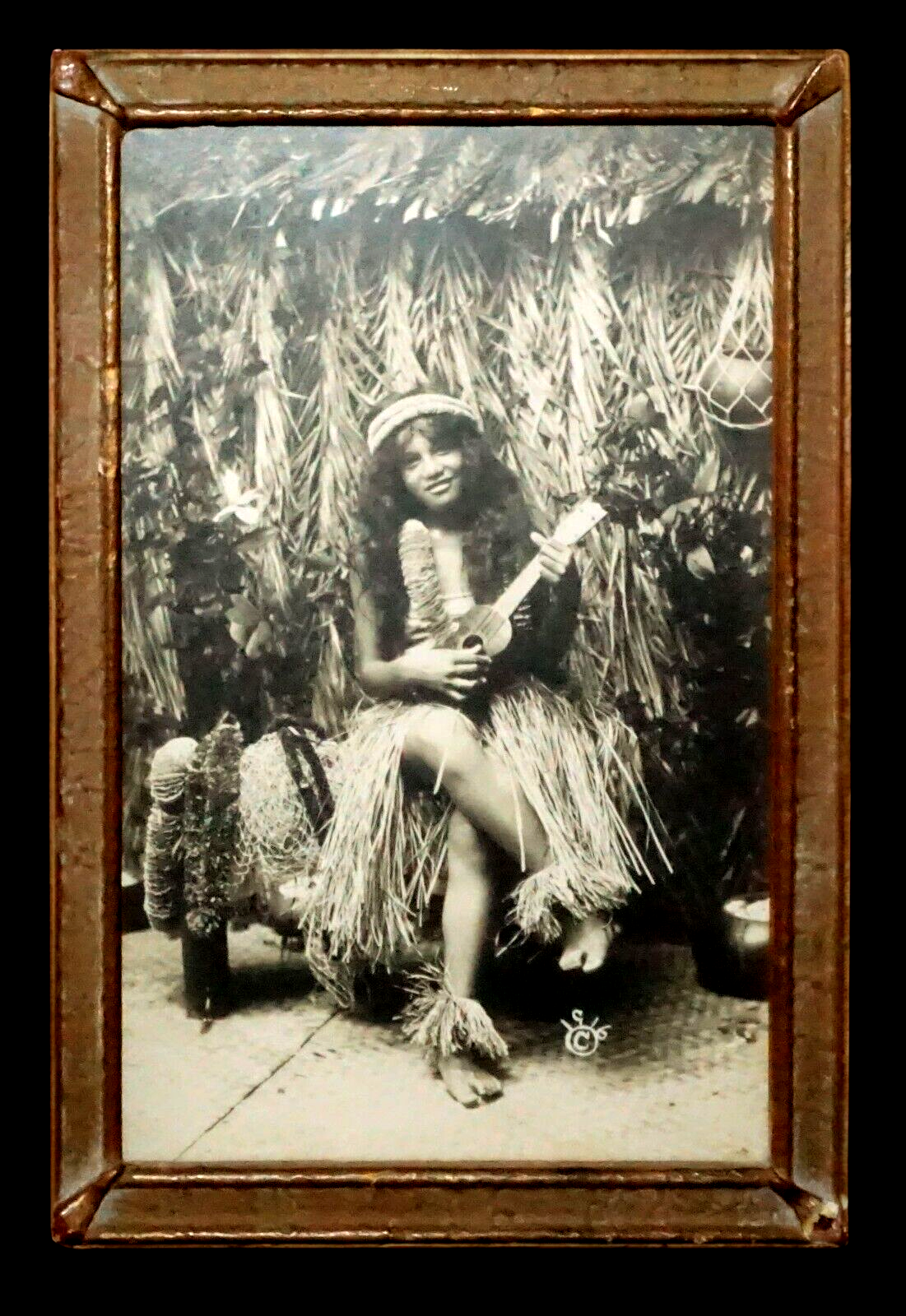 1916 Photograph of Hawaiian Hula Girl Playing Ukulele Next to Grass Shack (KoR)