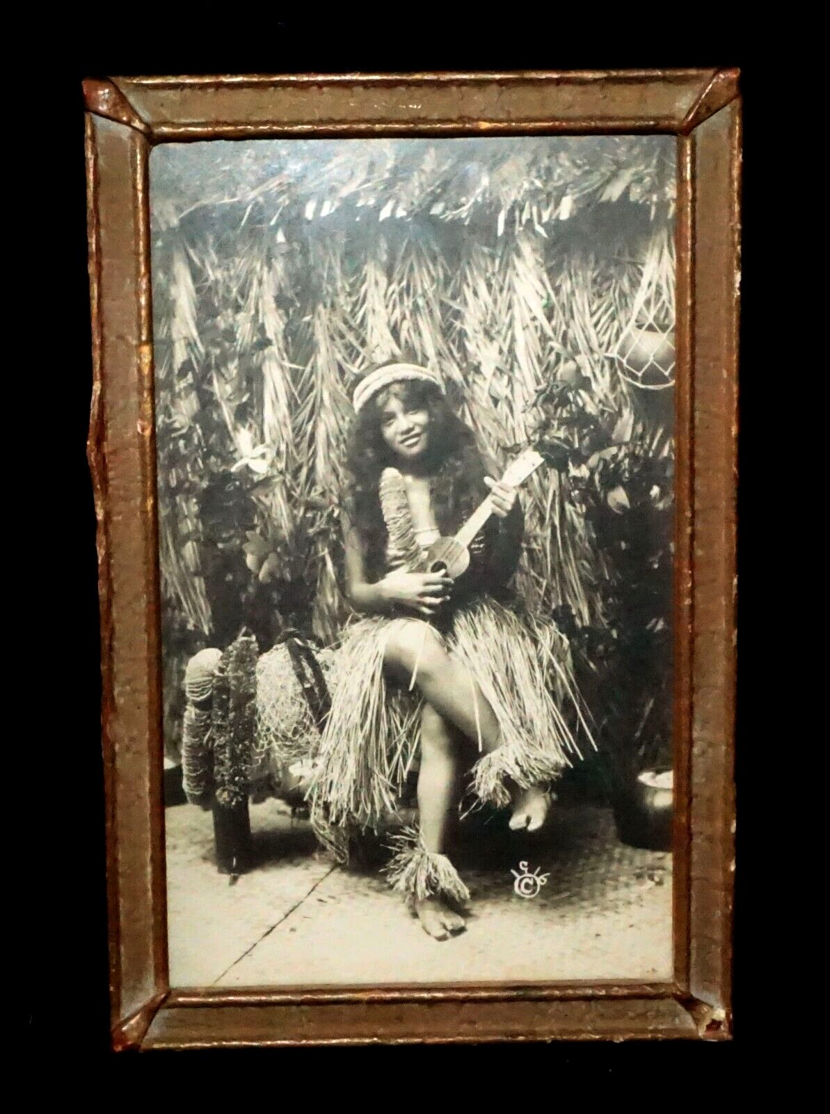 1916 Photograph of Hawaiian Hula Girl Playing Ukulele Next to Grass Shack (KoR)