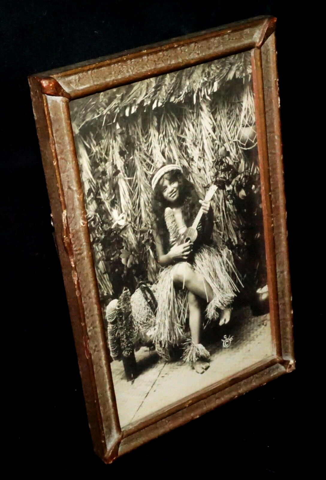 1916 Photograph of Hawaiian Hula Girl Playing Ukulele Next to Grass Shack (KoR)